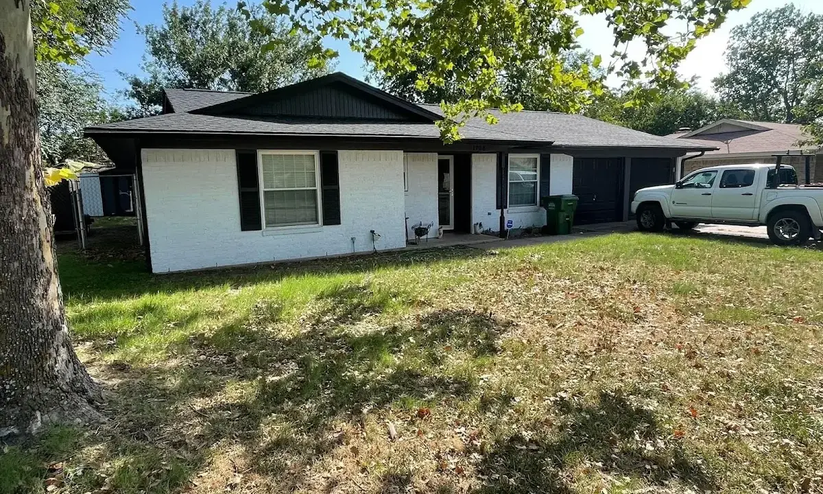 Professional roofing crew working on a residential roof in Kansas City